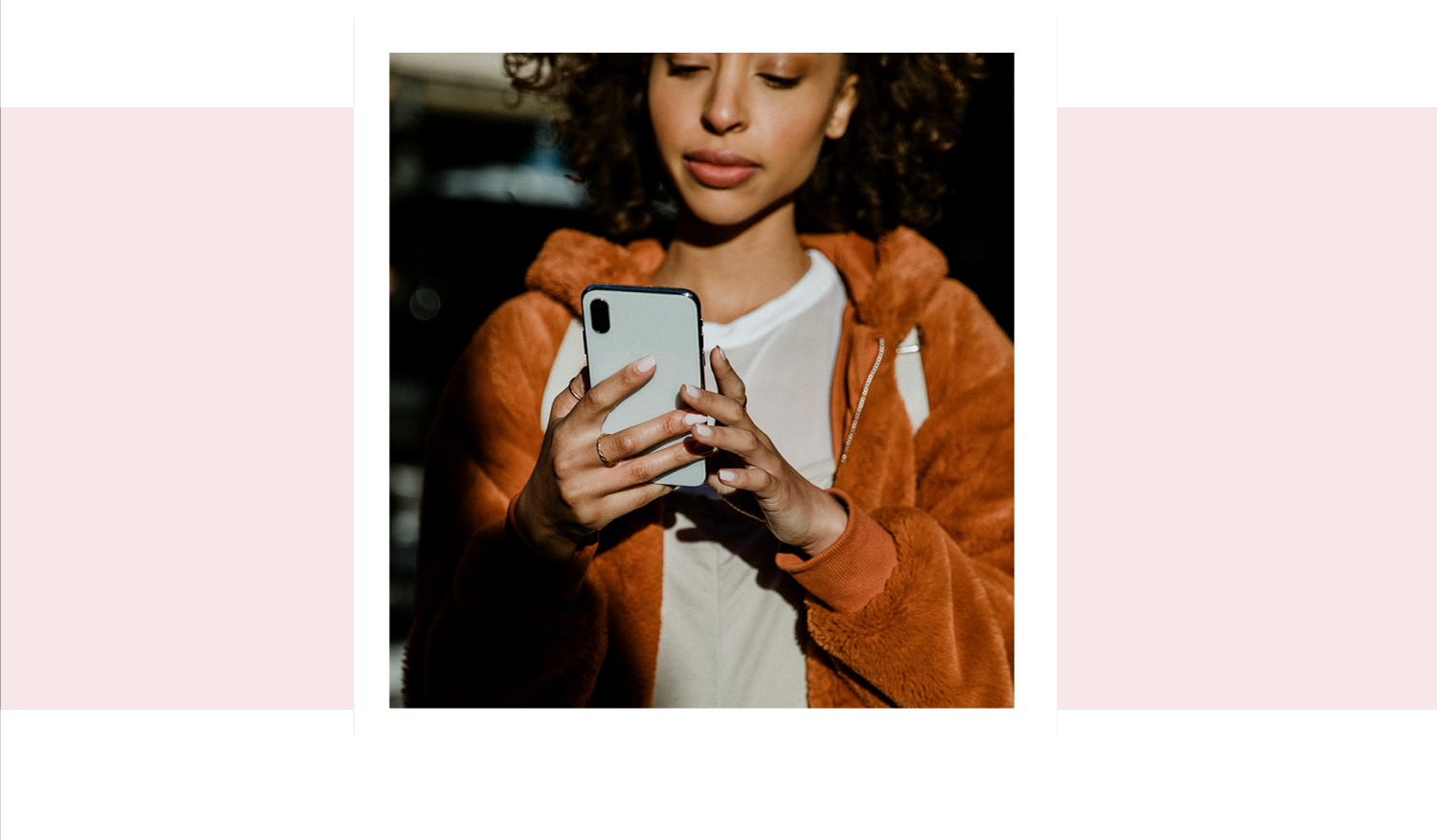 A woman searching on her phone for pregnancy support in Hampstead, North Carolina