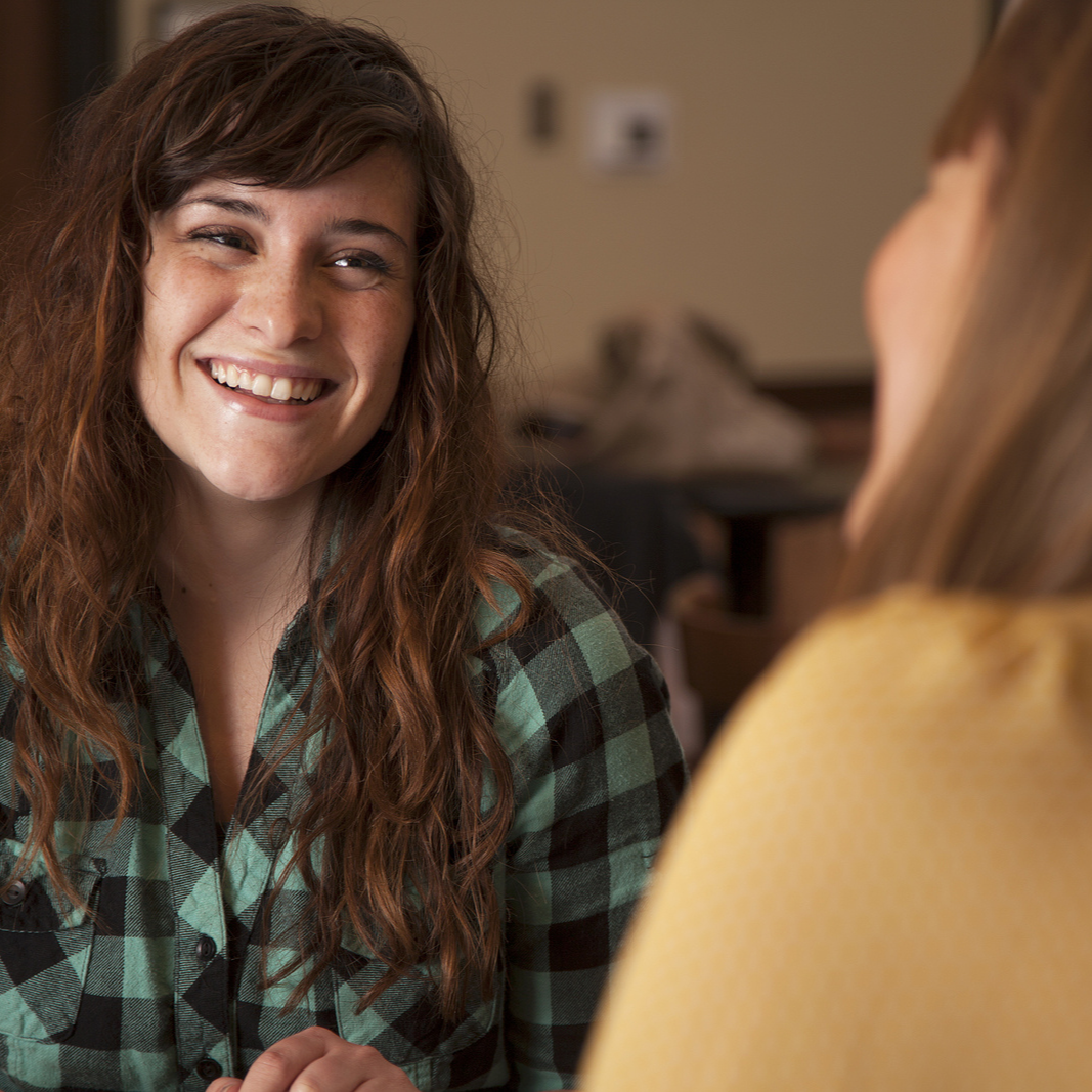 Two young women talking